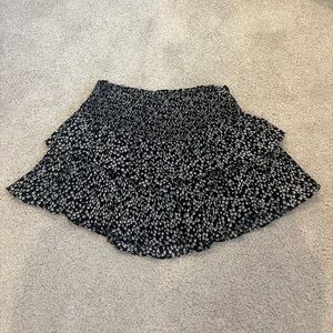 Two-tiered ruffle flowwy skirt/skort. Black with white flowers. Size M.
